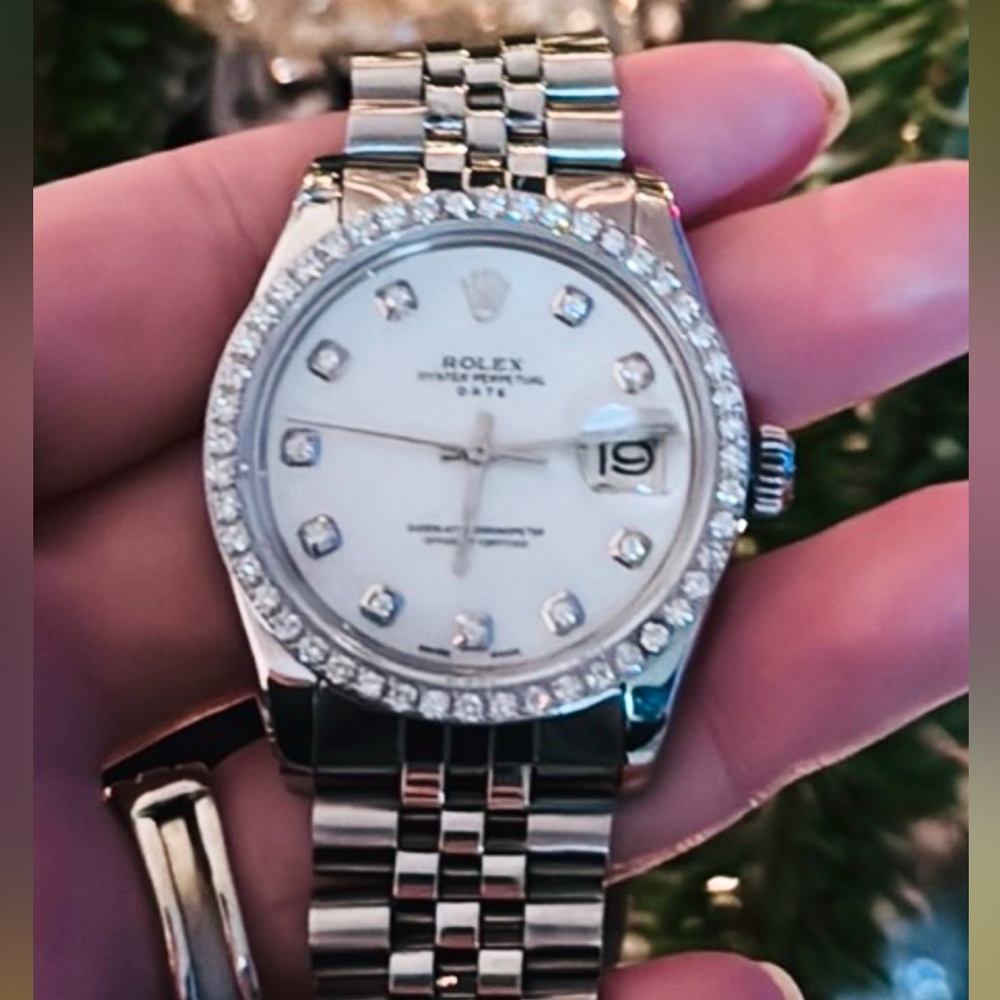 Ladies Rolex Mother of Pearl 34mm with Diamonds.